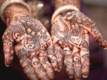 person showing hand tattoos