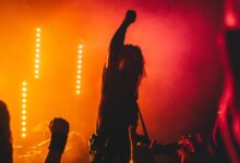 silhouette of woman singing on stage