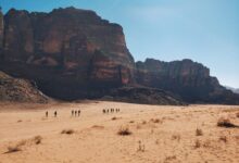 people walking on desert during daytime