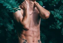man wearing green drawstring bottoms