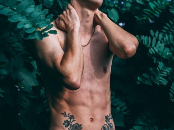 man wearing green drawstring bottoms