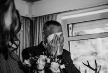 grayscale photo of man and woman