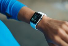 Person Wearing White Silicone Strap Black Smartwatch