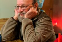 man resting his head on the table