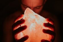 man holding Himalayan lamp