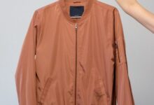 brown long sleeve shirt on white clothes hanger