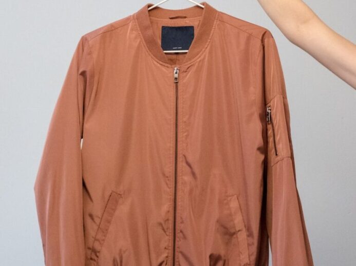 brown long sleeve shirt on white clothes hanger