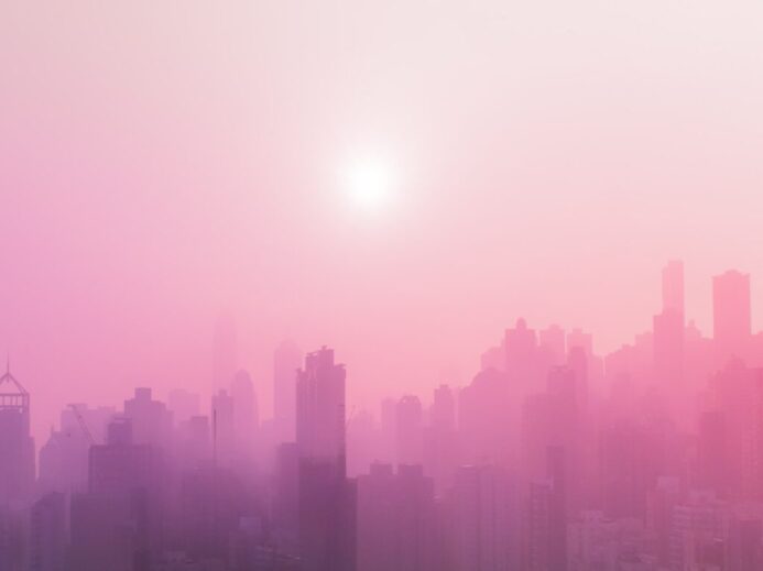 skyscraper covered with fog at daytime