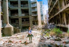 woman wearing white and green dress surrounded by storey buildings