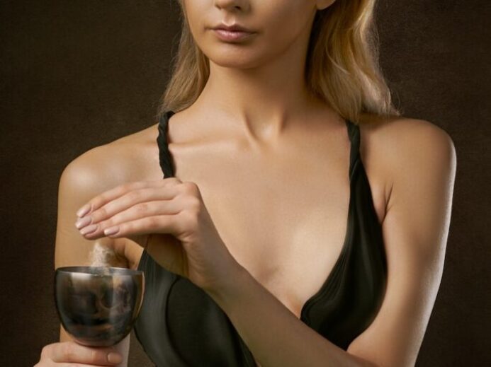 woman standing and holding glass of wine
