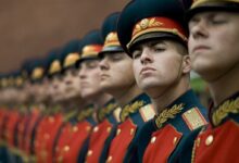 Men in Black and Red Cade Hats and Military Uniform