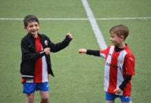 two boys in soccer field