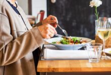 person eating vegetable salad