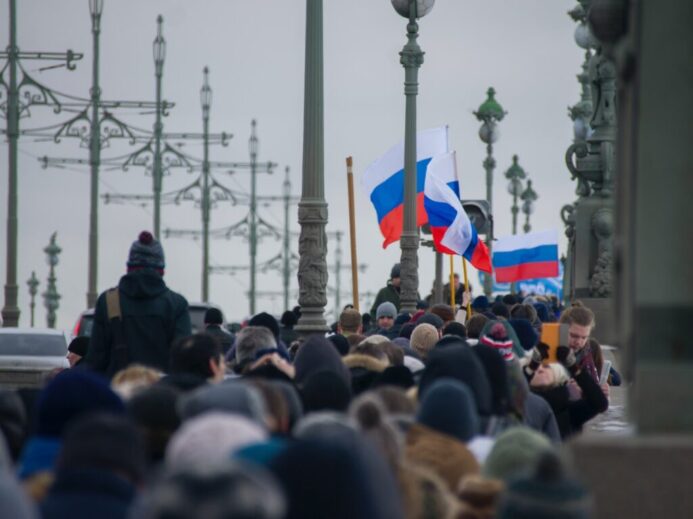 group of people walking straight during daytime