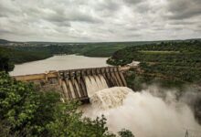 water falls under cloudy sky during daytime