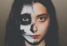 woman with skull paint on her half face