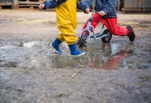 two toddlers playing outdoors