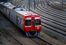 red and white train on train station