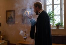 Orthodox Priest Holding Censer and Praying