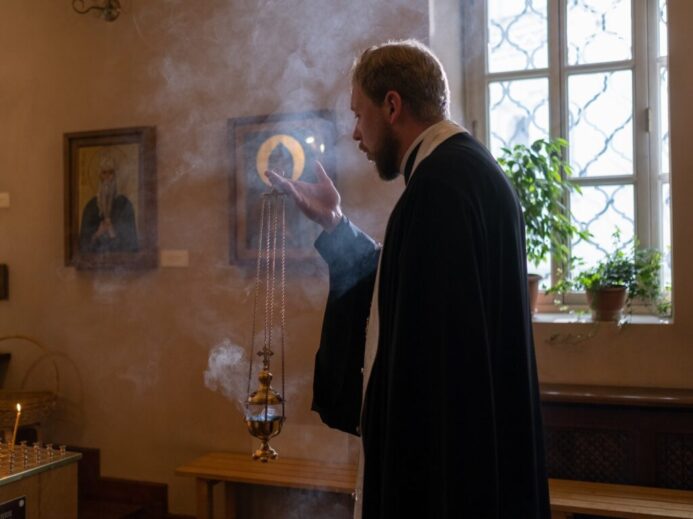 Orthodox Priest Holding Censer and Praying