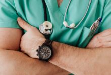 Crop unrecognizable male doctor with stethoscope