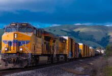 yellow and black train near mountain