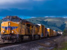 yellow and black train near mountain