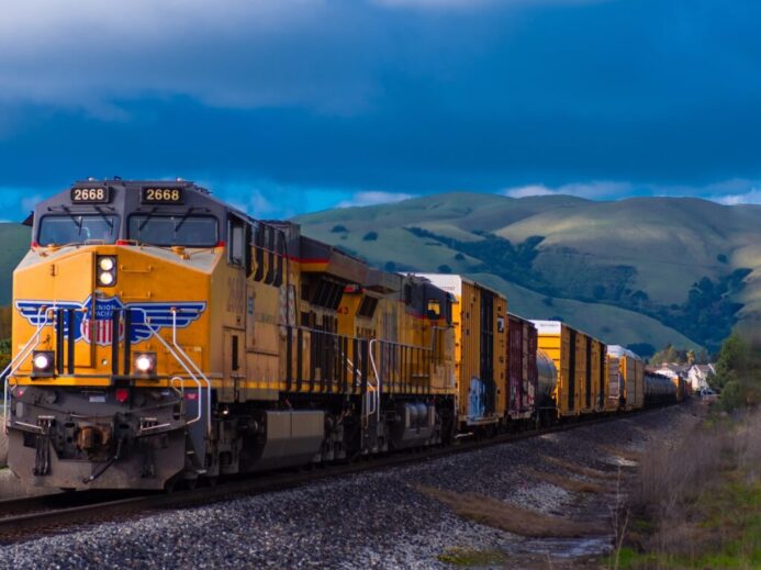 yellow and black train near mountain