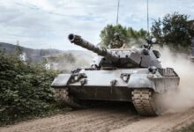 battle tank on green grass field during daytime