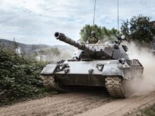 battle tank on green grass field during daytime