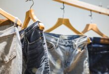 selective focus photography of hanged denim jeans