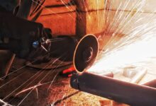 person grinding pipe steel wool photography