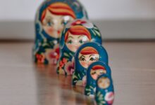 red blue and yellow ceramic figurine