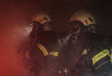man in black helmet and helmet