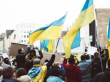 People Gathering on Street Holding Ukraine Flags