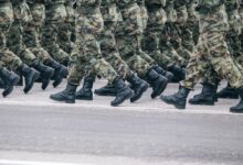 men in green and brown camouflage uniform