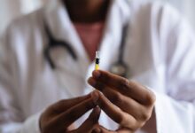 Person Holding Injection