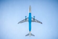 low angle photography of blue commercial airplane