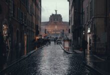 people walking on street between buildings during daytime