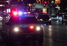 black car on road during night time