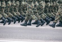 men in green and brown camouflage uniform