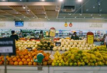 yellow and green fruits on white metal rack