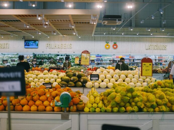 yellow and green fruits on white metal rack