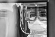grayscale photo of man wearing goggles