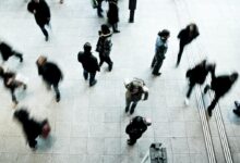 people walking on grey concrete floor during daytime