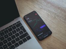black android smartphone on macbook pro