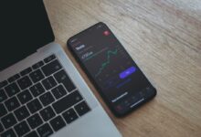 black android smartphone on macbook pro