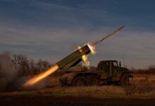 a military vehicle with a missile in the air