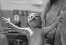 grayscale photography of a new born baby