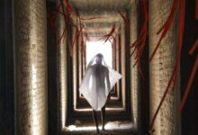 person walking on hallway inside building